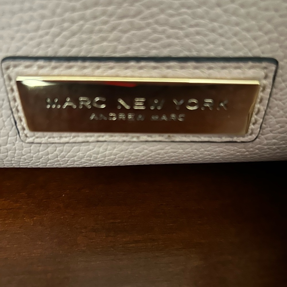 Marc New York pale pink purse with tassels and gold accents
